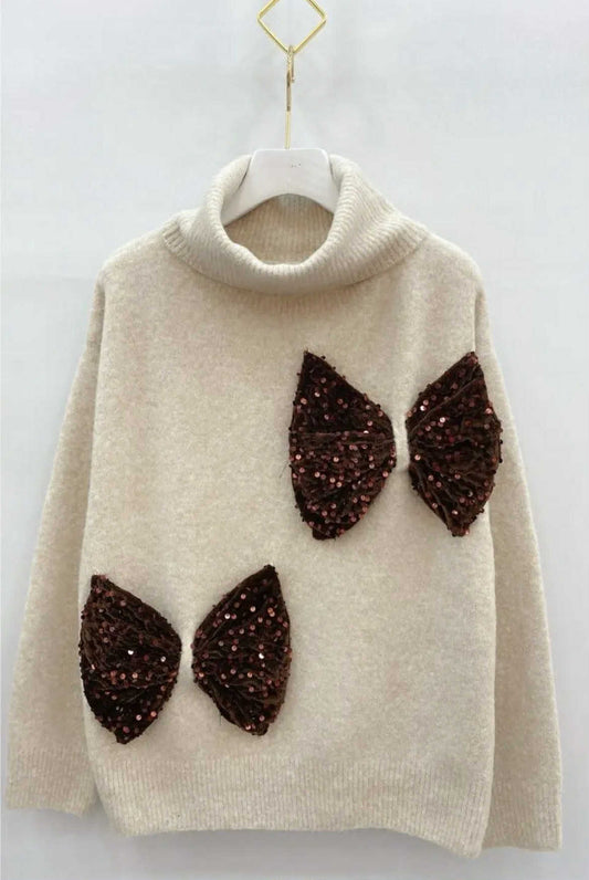 Beige coltrui met pailletten strik