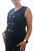 Glitter vest met gouden buttons.